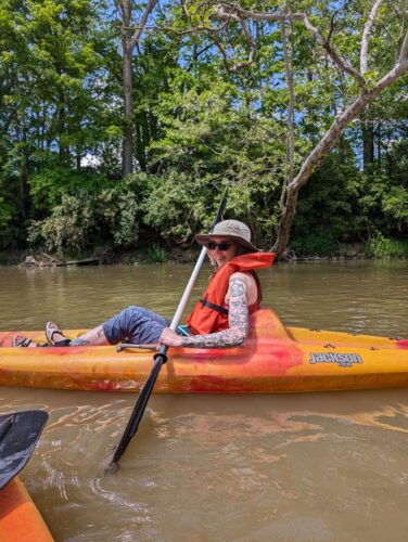 Jenny, Senior Content Manager, kayaking on the White River.